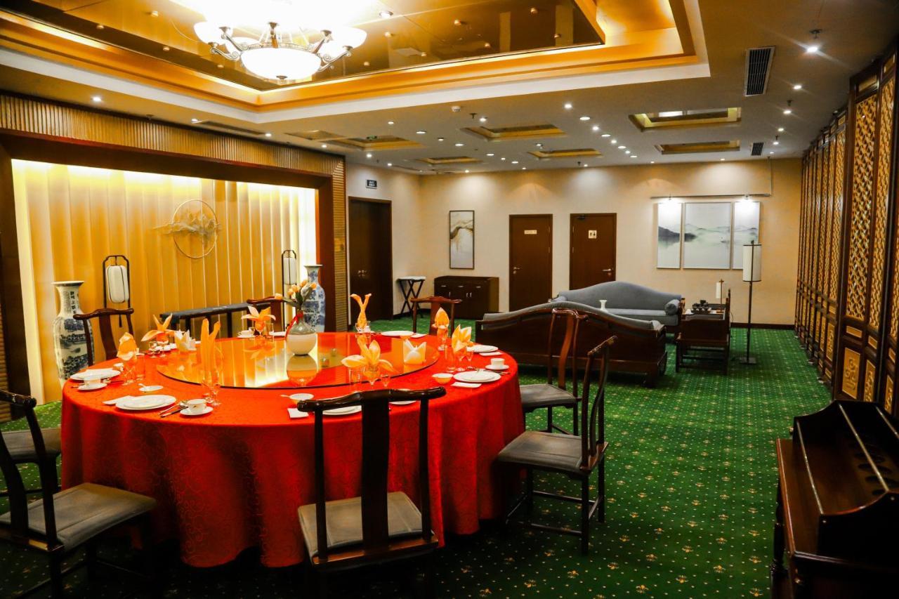 Beijing Palace Soluxe Hotel Astana Exterior photo A private dining room at a restaurant in Beijing