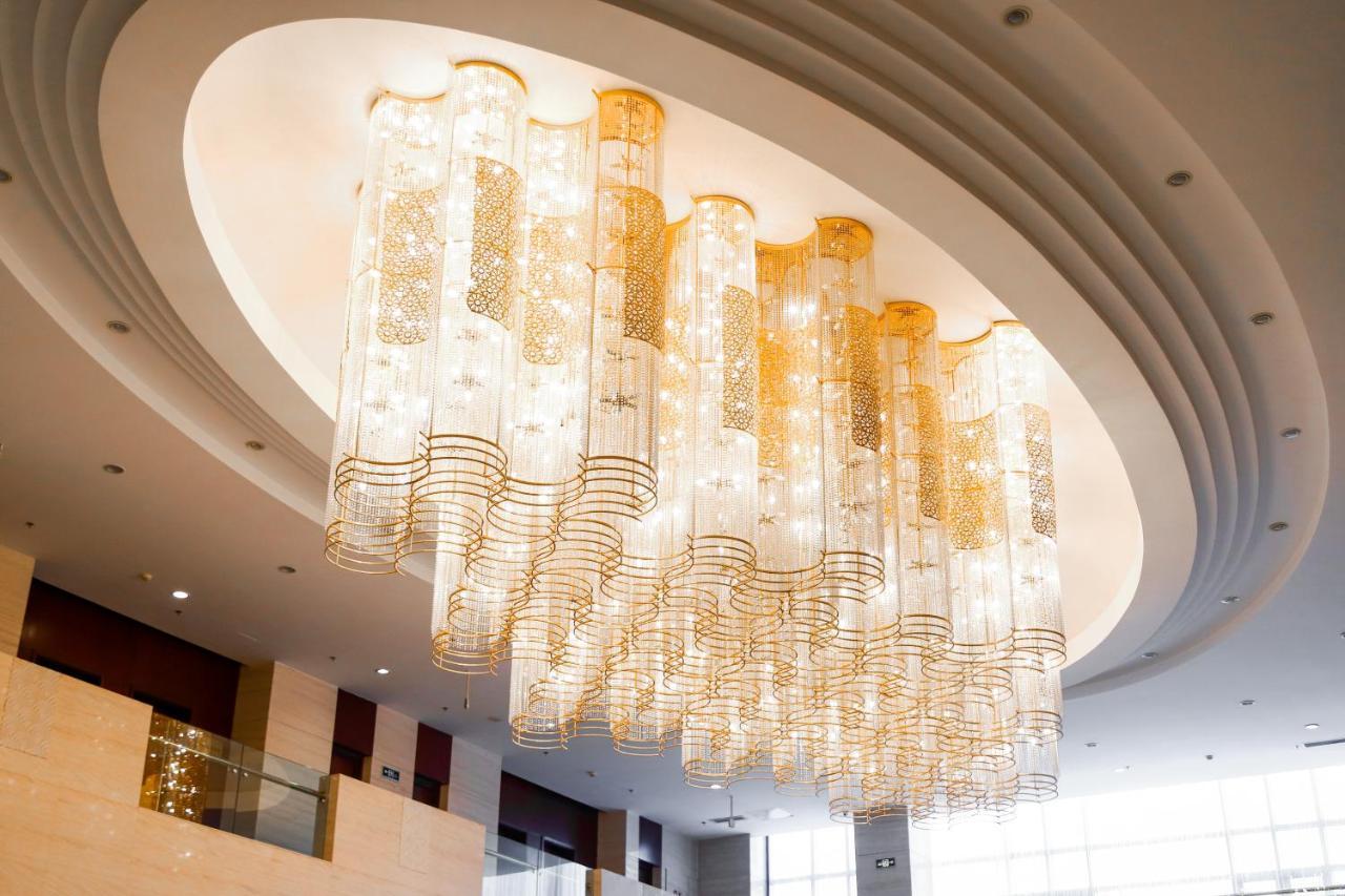 Beijing Palace Soluxe Hotel Astana Exterior photo The chandelier at the lobby of the Ritz-Carlton, Dubai