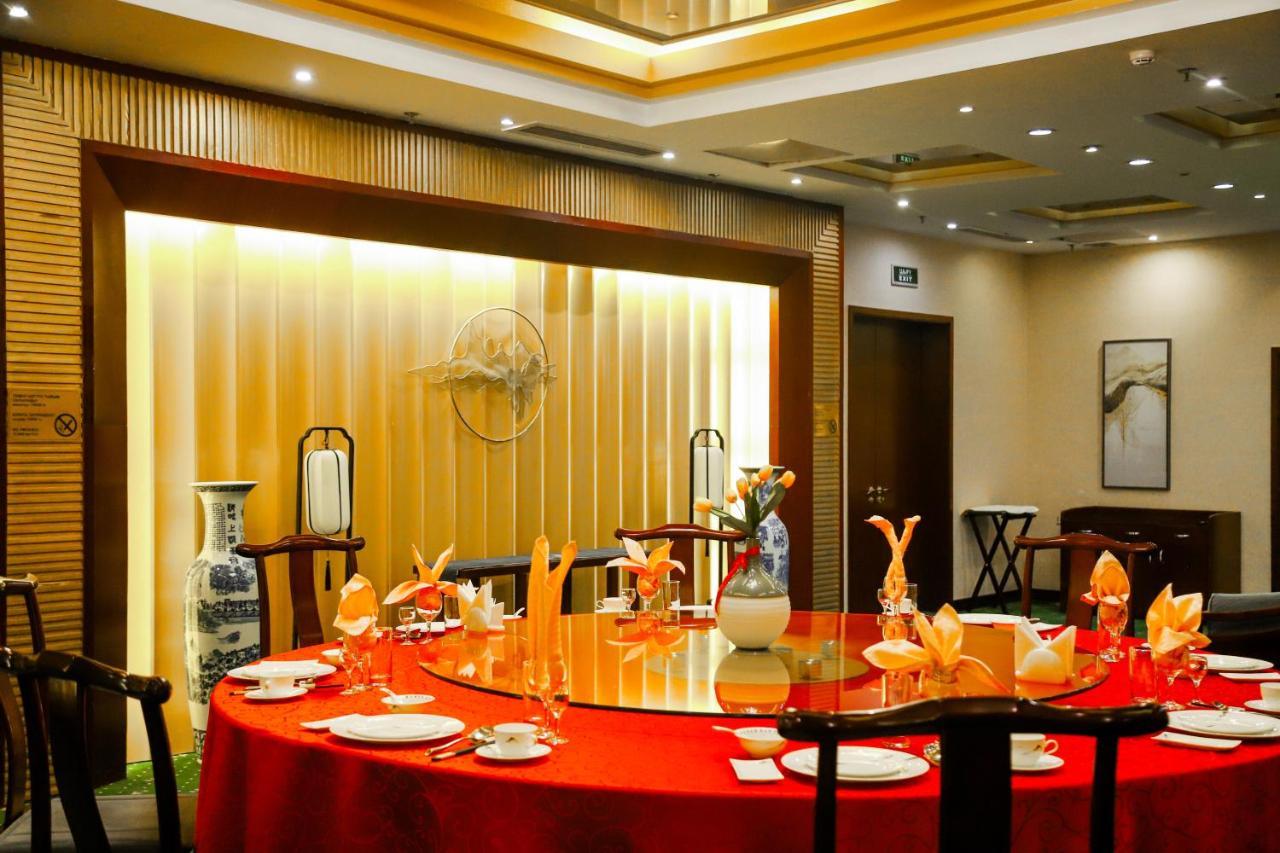 Beijing Palace Soluxe Hotel Astana Exterior photo A restaurant in Beijing