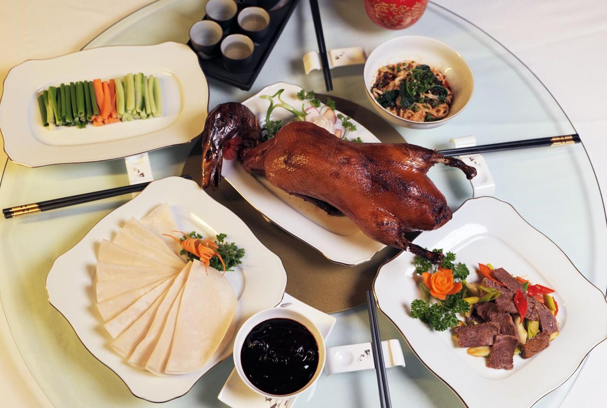 Beijing Palace Soluxe Hotel Astana Exterior photo A selection of dishes prepared with duck