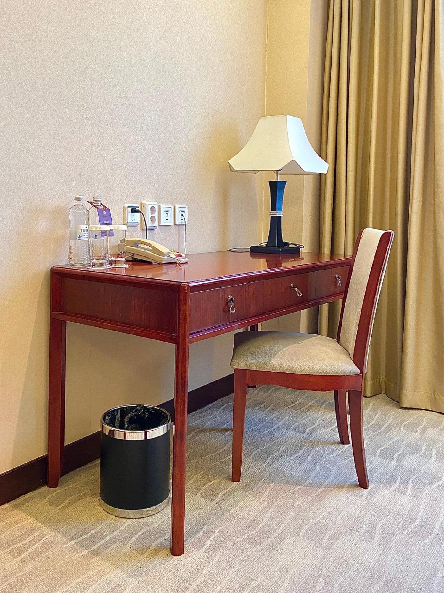 Beijing Palace Soluxe Hotel Astana Exterior photo A writing desk in a hotel room