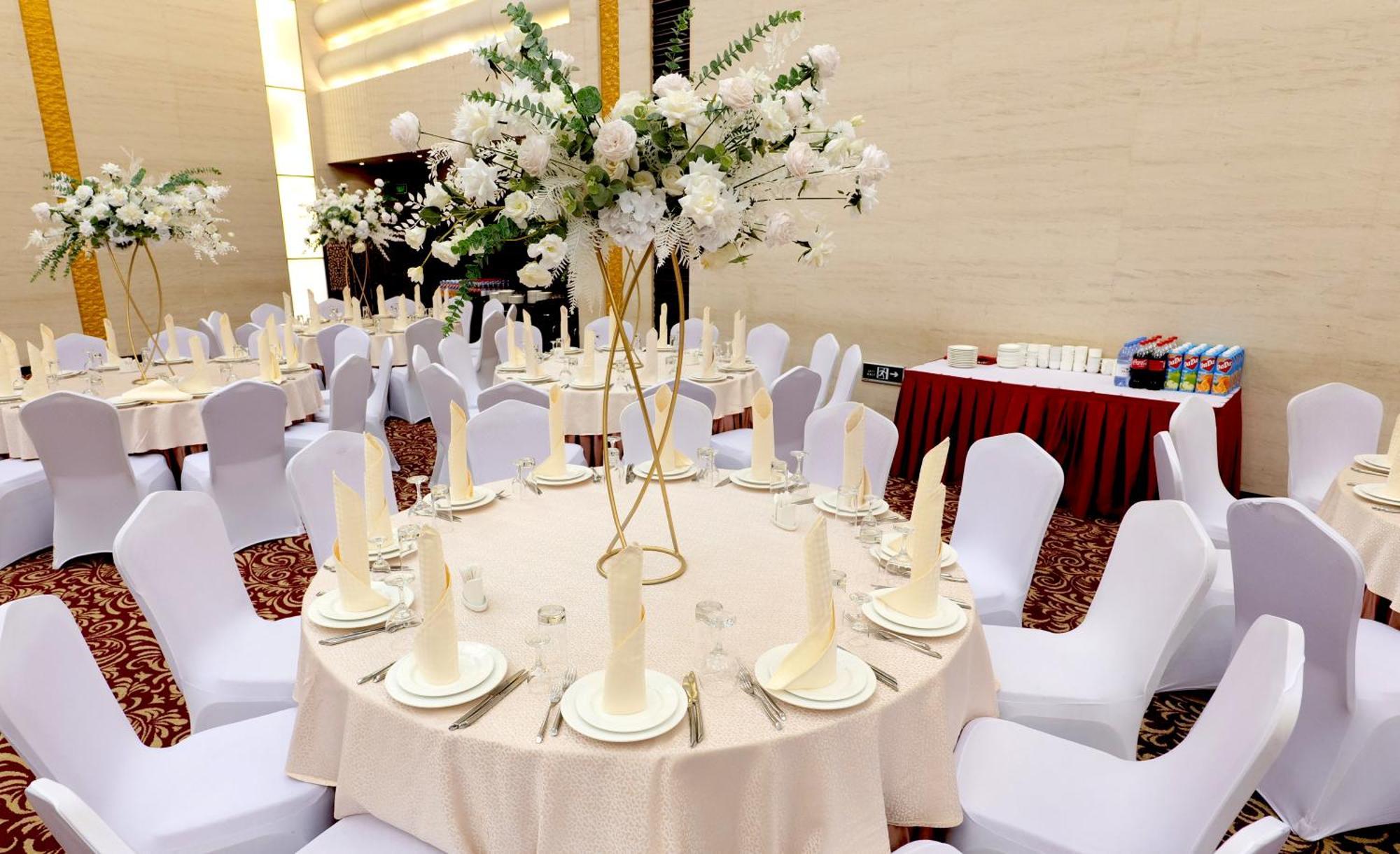 Beijing Palace Soluxe Hotel Astana Exterior photo A table set for a formal dinner