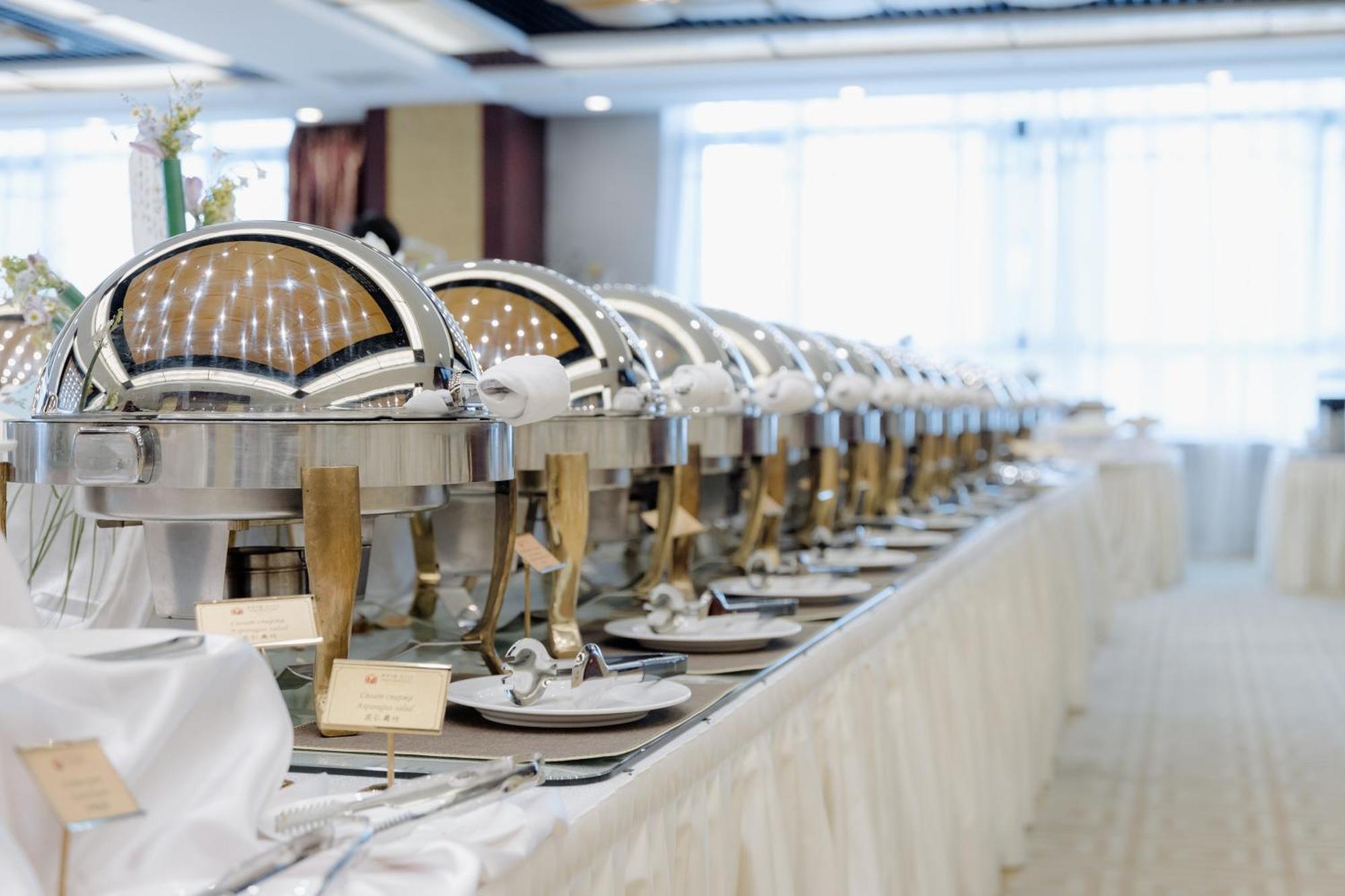 Beijing Palace Soluxe Hotel Astana Exterior photo A row of chafing dishes