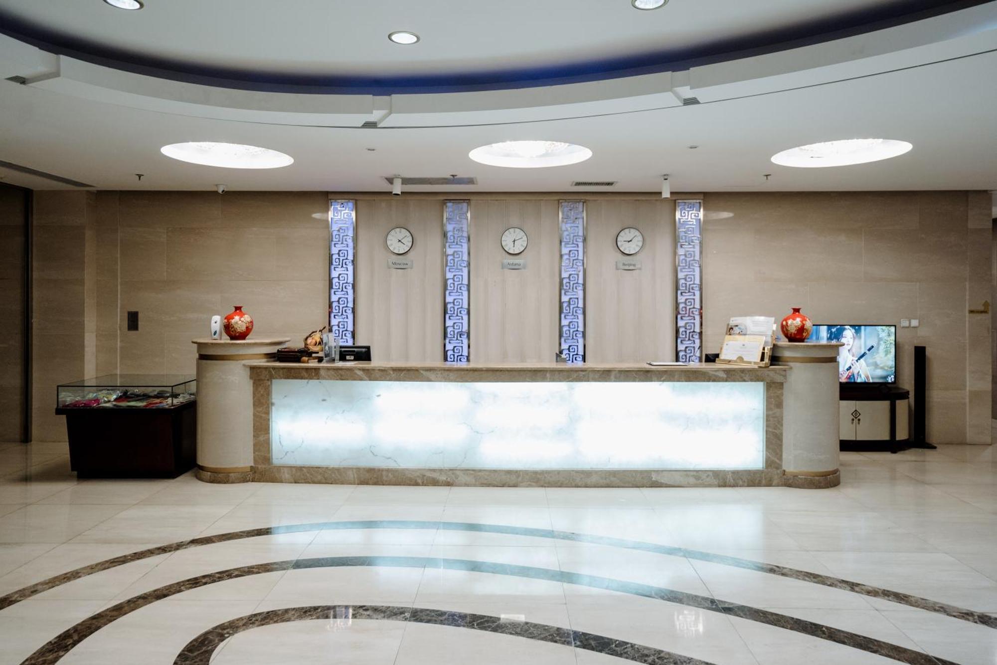 Beijing Palace Soluxe Hotel Astana Exterior photo Reception desk